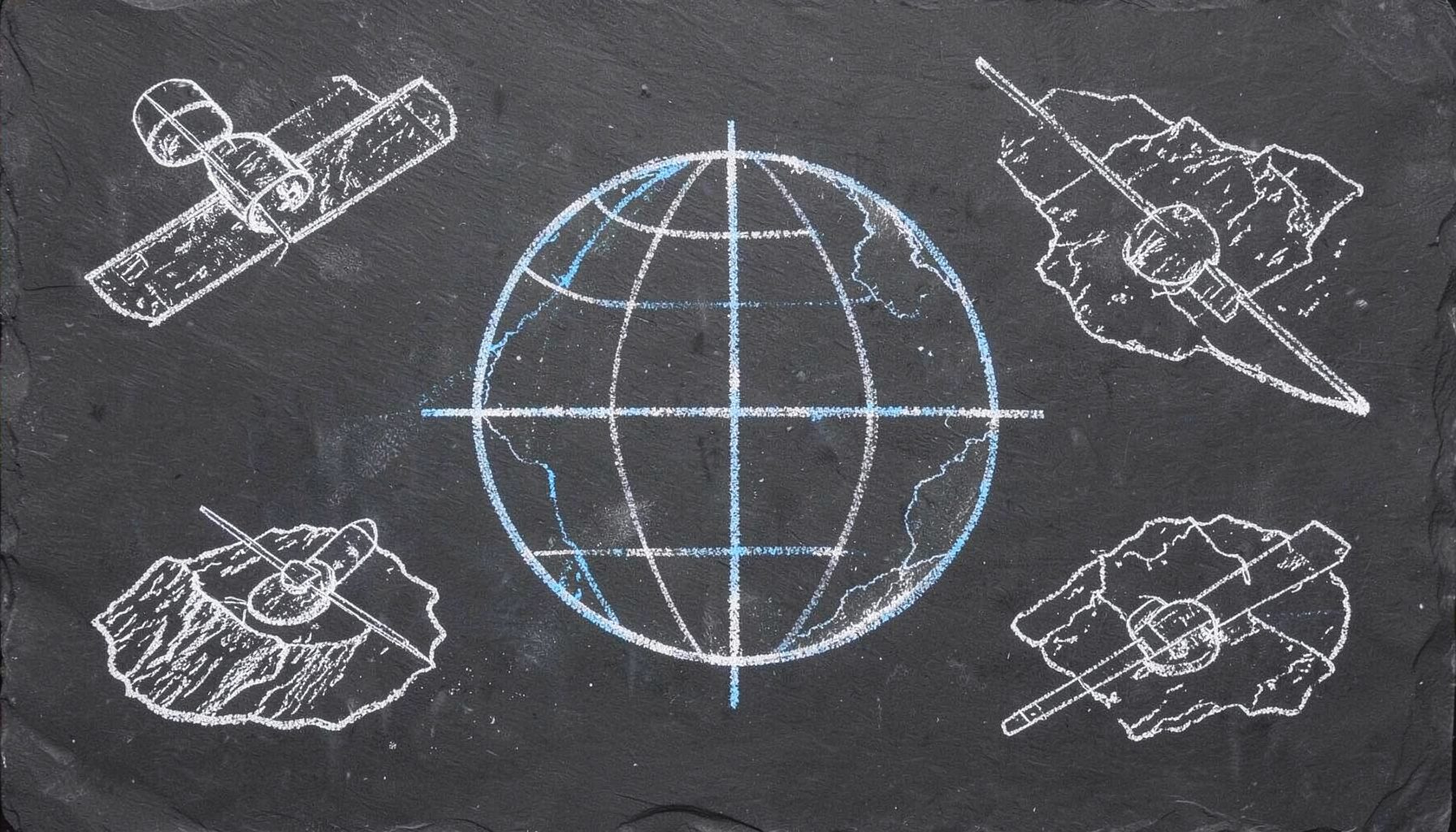 Chalk-drawn globe with latitude and longitude grid lines on a dark slate board