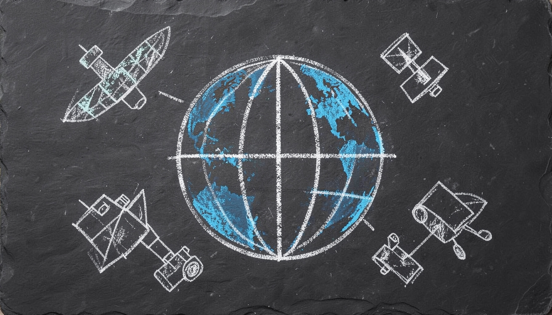 A chalk drawing on a dark slate board showing a globe with latitude and longitude grid lines, surrounded by hand-drawn survey markers